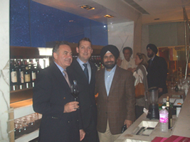 Andrew Steele, GM of Shangri-La (M)with Aman Dhall of Brindco (L) With the Enomatic machine in the background