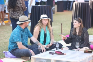 some the visitors enjoying a relaxed conversation over wines